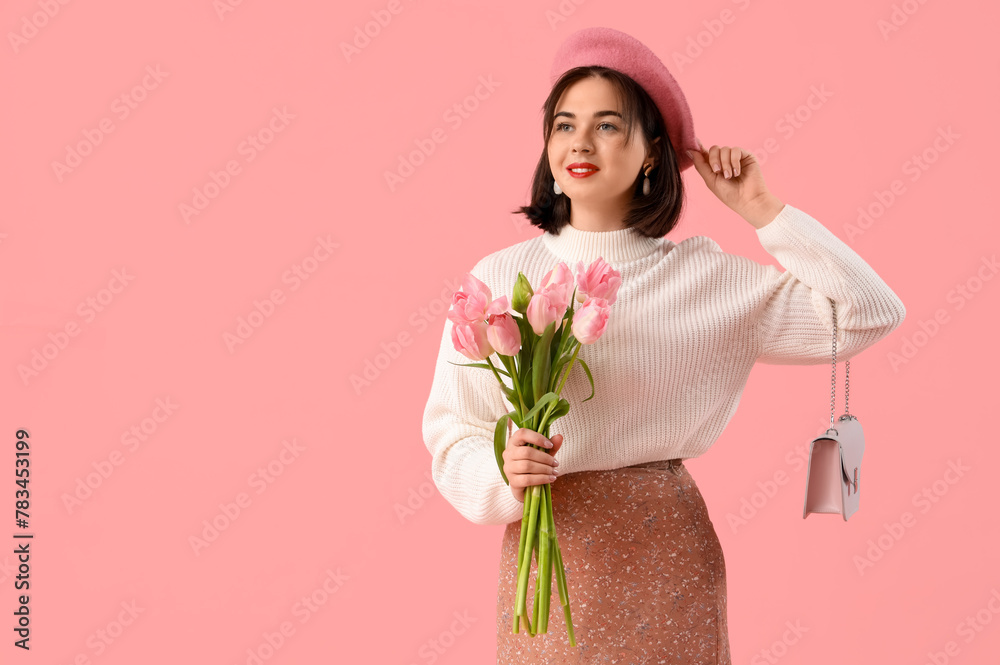 Portrait of fashionable young woman in beret with tulip flowers on pink background Portrait of fashionable young woman in beret with tulip flowers on pink background