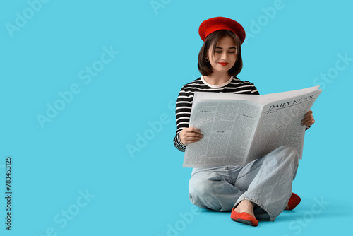 Young woman in red beret re...
