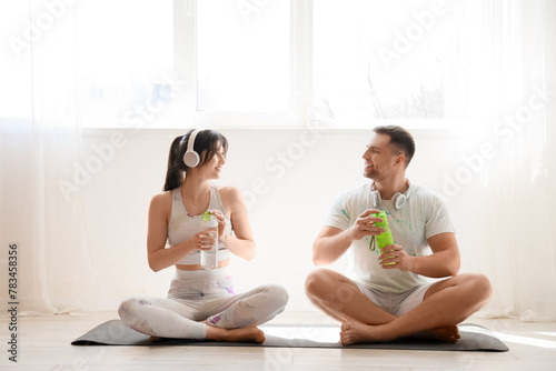 Sporty young couple with he...