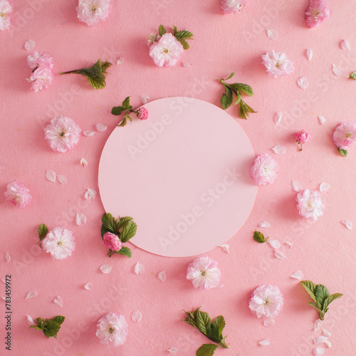 Pink flower pattern on pink pastel background. Minimal spring concept. Flat lay. Copy space
