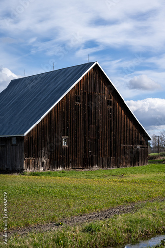 Rustic wood barn in rural America, agricultural background landscape 