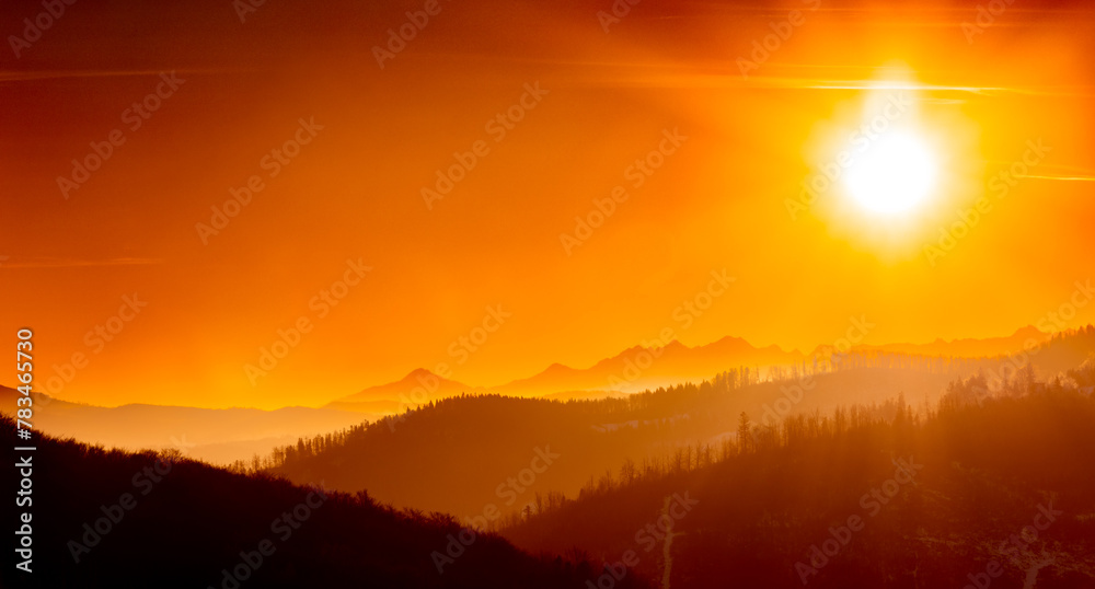 Panoramic dreamy view of sunrise above mountains