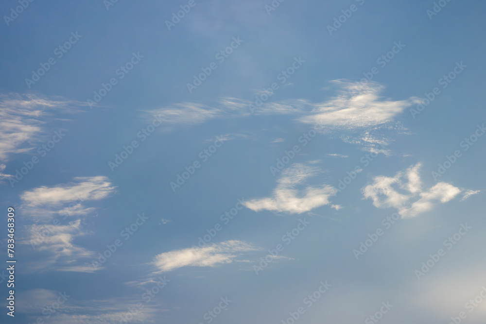 A clear blue sky with a few clouds A clear blue sky with a few clouds