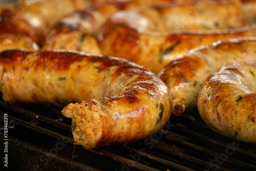 A close up of a grill with a piece of meat on it. The meat is cooked and has a crispy exterior