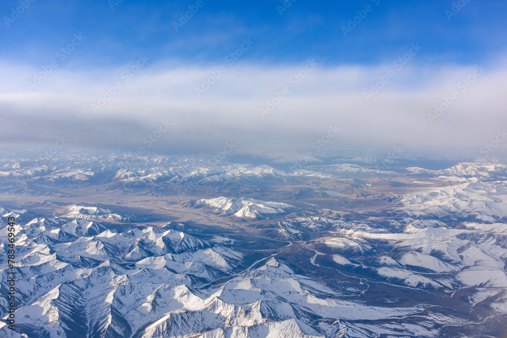 Naklejka premium Aerial view of snow capped mountains in Sichuan and Tibet, China