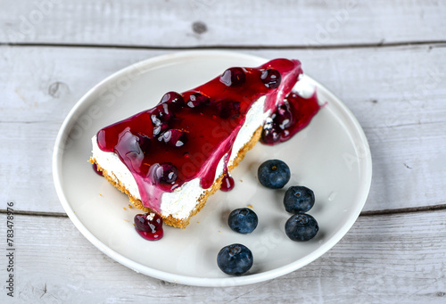 Fresh blueberry fruit cheese cake with jam and fruits on top