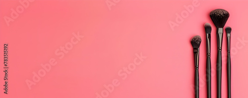 Makeup brushes web banner. Makeup brushes isolated on pink background with copy space.