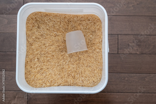 Raw Rice in bucket at home pantry