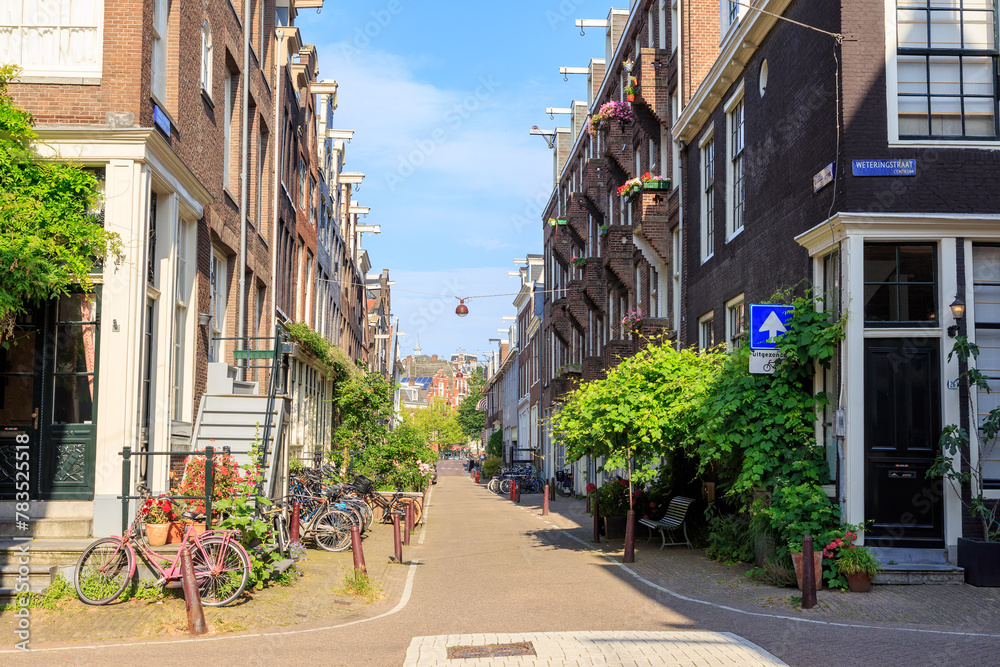 Amsterdam, Netherlands - June 30, 2019: The historic city center of Amsterdam in the morning. Tweede Weteringdwarsstraat Street