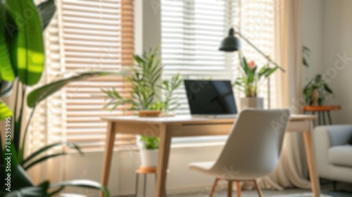 Soft focus on a home office setup with stylish furnishings and indoor plants. Resplendent.