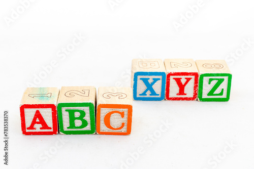 ABC and XYZ wooden alphabet blocks isolated on white background photo