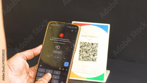 26th February, 2024, Kolkata: A man scanning QR code for online payment.