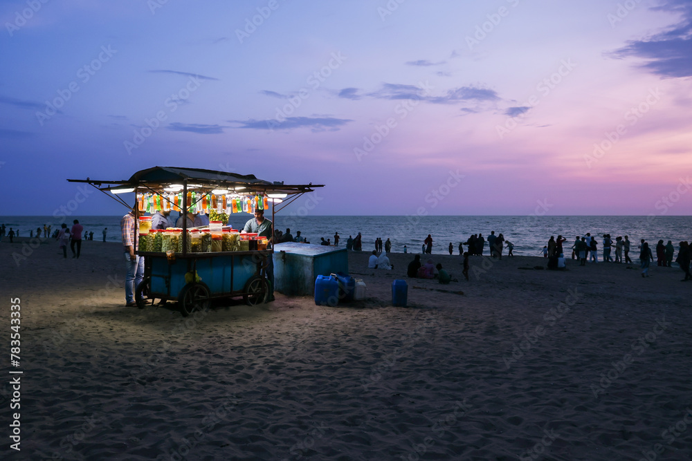 Kozhikode beach night view sunset in Kerala India. Food snacks stalls street food Kozhikode beach.