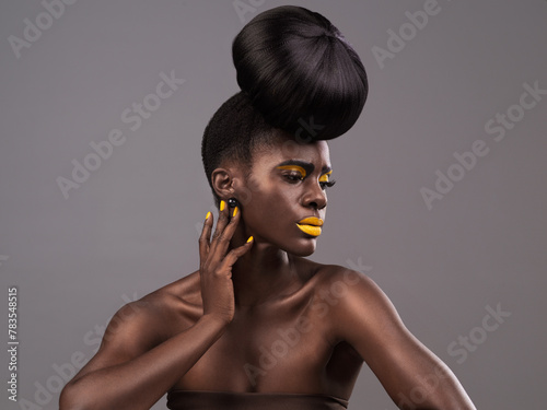 Beauty  makeup and black woman in studio with lipstick  cosmetics and eyeshadow on gray background. Creative  aesthetic and female model with yellow lip balm  nail polish manicure and cosmetology