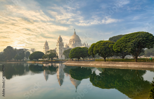 Victoria Memorial Kolkata, an ancient colonial-style building with pond at sunrise © Roop Dey