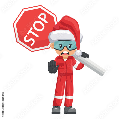 Annoyed industrial mechanic worker with Santa Claus hat with stop sign. Engineer with his personal protective equipment. Safety first. Industrial safety and occupational health at work