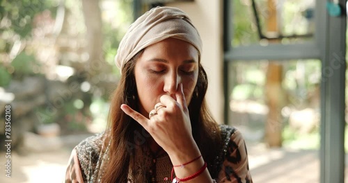 Woman, meditation and breathing nostril for exercise or holistic ritual for spiritual or natural healing in sacred place. Female person, traditional healer and shaman for cleansing mind with yoga photo