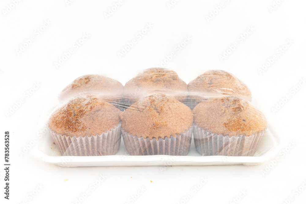Cupcakes in a sealed plastic pack on white isolated background Cupcakes in a sealed plastic pack on white isolated background