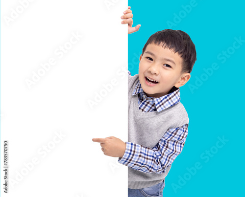 Happy Asian boy  holding and pointing white  empty banner