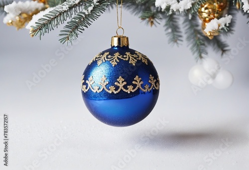 Beautiful Christmas decoration with a ball in snow in bright colours 
