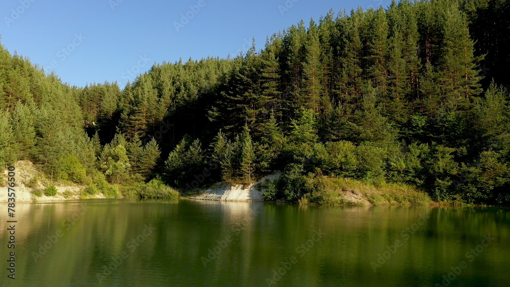 Drone shot aerial view scenic landscape of Big Lake and nature wood and forest.