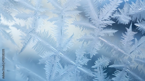 A macro shot of ice crystals forming on a windowpane, creating delicate patterns