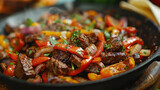 The photo is of a skillet with beef fajitas.