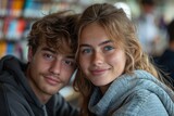 A close-up of a smiling young couple in a cozy library environment, conveying warmth and connection