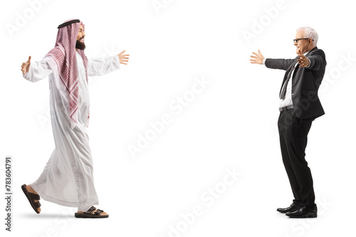 Full length profile shot of a saudi arab man meeting a mature businessman