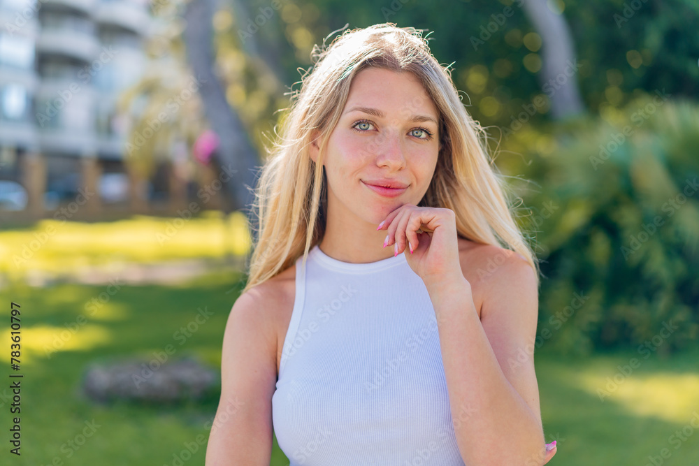 Young blonde woman at outdoors With happy expression Young blonde woman at outdoors With happy expression