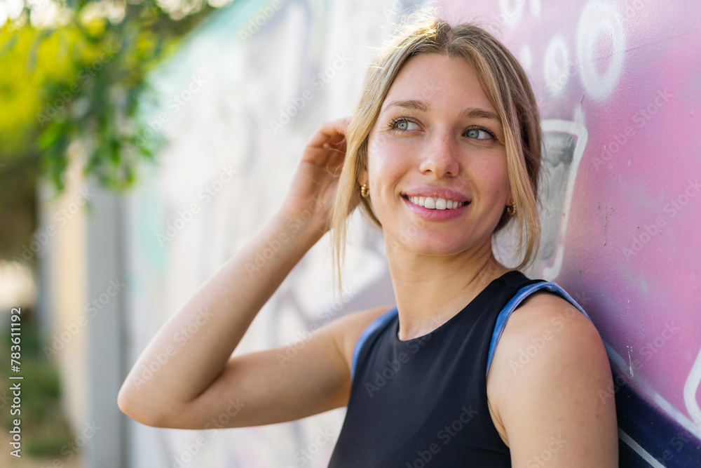 Young blonde woman at outdoors With happy expression Young blonde woman at outdoors With happy expression