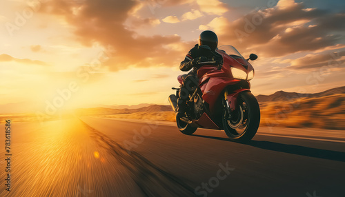 Man riding a motorcycle at sunset