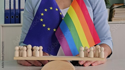 European Union, EU flags and rainbows, conceptual picture about human rights and confrontation. LGBT rights in Europe and homophobia photo