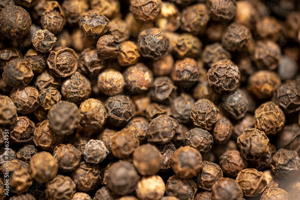 Closeup shot of black peppercorns background Closeup shot of black peppercorns background
