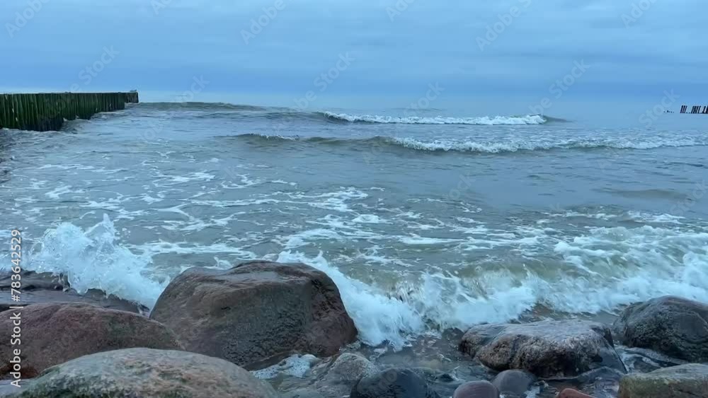 The waves of the Baltic Sea are beating against the rocks on the shore. The waves of the Baltic Sea are beating against the rocks on the shore.