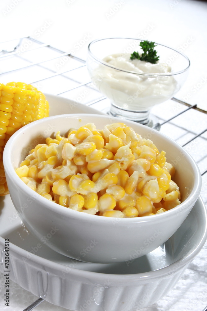 Vertical shot of a white bowl with corn Vertical shot of a white bowl with corn