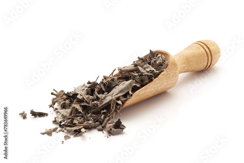 Front view of a wooden scoop filled with Organic Nirgundi (Vitex negundo) leaves. Isolated on a white background.