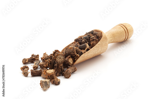 Front view of a wooden scoop filled with dry Organic Gulvel or Giloy (Tinospora cordifolia) herb (Heart-leaved moonseed, guduchi, giloy, crispa). Isolated on a white background. photo