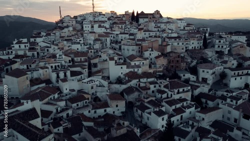 Aerial video of the white buildings on the rocky mountains, Comares , Spain photo