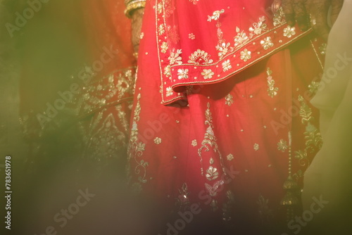 red bridal lehenga with intricate chumki work- an indian bridal wear photo