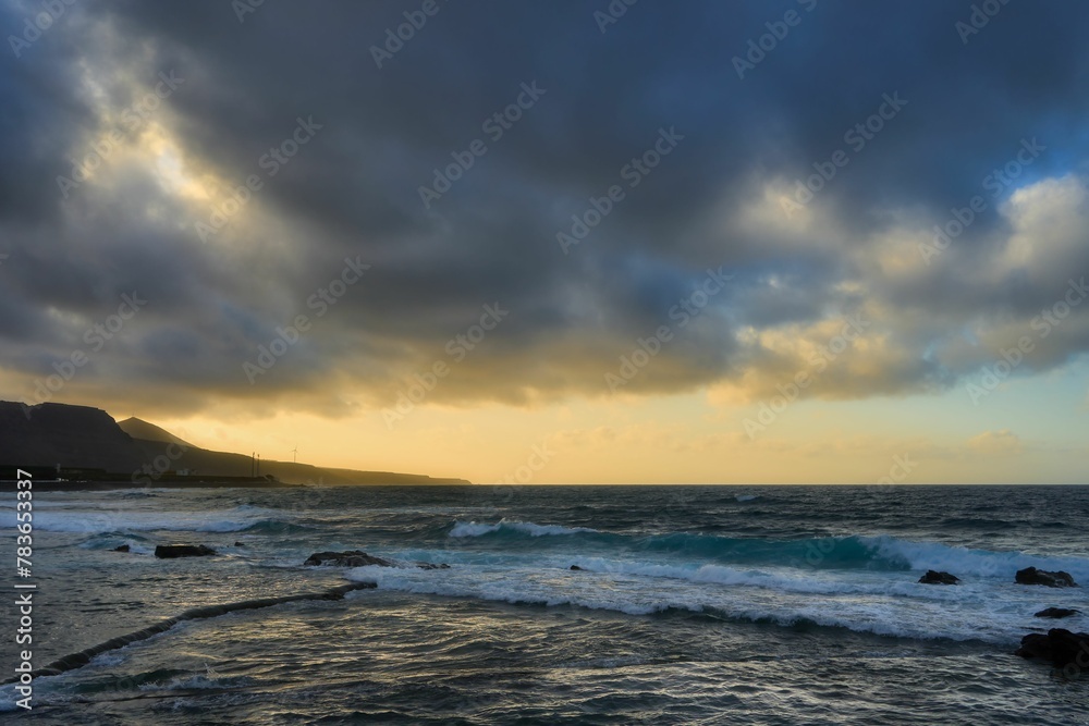 Scenic view of El Puertillo beach in Canary Island, Spain, in a sunset sky background