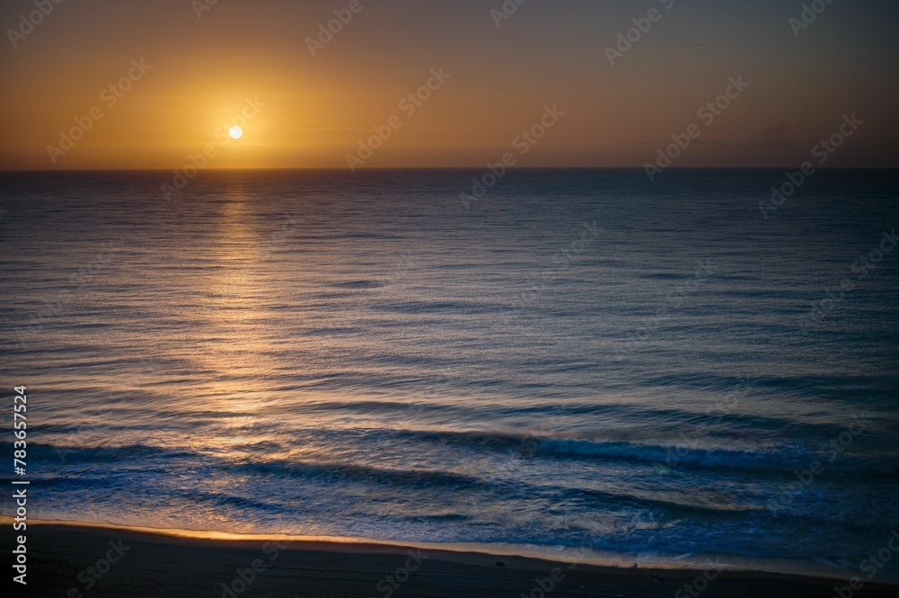 Beautiful shot of a bright sunset sky over the blue sea