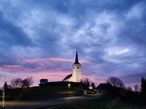 Scenic of the Church of St. Primus and Felician under the purple sunset sky, Slovenia