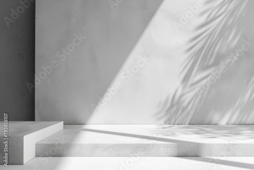Minimalistic abstract light grey wall background for product presentation with sunlight shadow of plant leaves