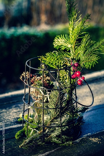 Vertical closeup shot of an outside Christmas decoration with fir tree branches
