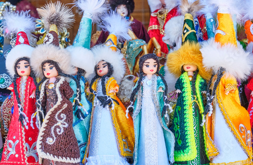 Kazakh small dolls in traditional national clothes.Souvenir shop at local market, Almaty,Kazakhstan