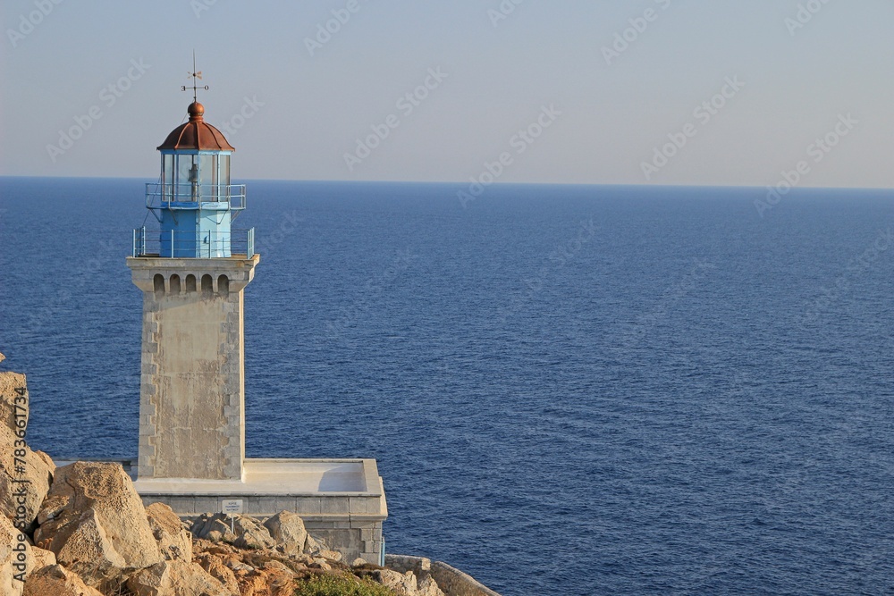 Cape Tainaro lighthouse in Mani Greece with the blue sea and the horizon in the background