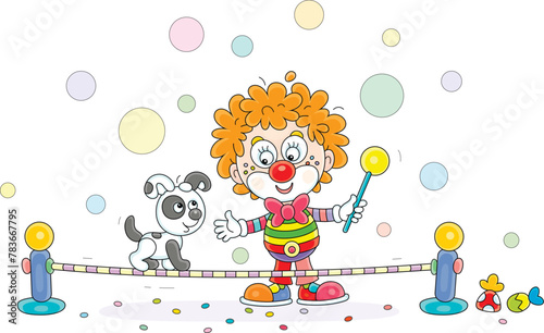 Funny red circus clown playing with a his cheerful small puppy balancing on a taut rope in a fun performance, vector cartoon illustration on a white background
