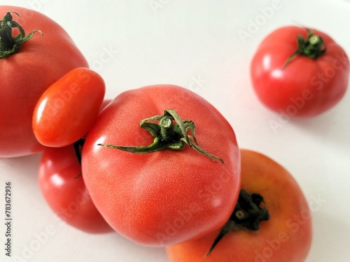 Many tomatoes on creamy background. © Foodmar