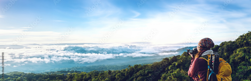 The young woman travels to take pictures of the sea mist on the mountain. Travel relax. Natural Touch countryside. at Chiangmai inThailand
